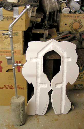Photo of Two halves of the Styrofoam carved to fit around the steel armature.