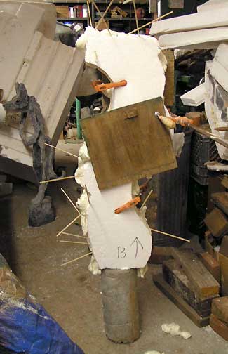 Image showing Styrofoam clamped together while adhesive hardens.