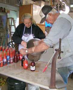 Capping the bottles of tomato juice